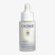Флакон сыворотки Caudalie Vinoperfect для ухода за пигментными пятнами